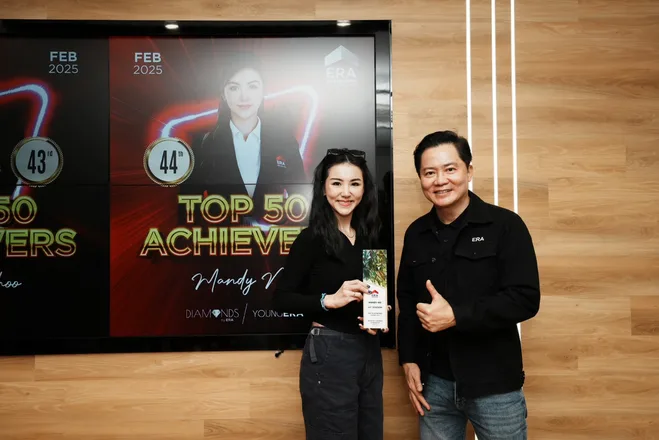 Mandy Ng receiving her ERA Top 50 Achievers trophy for 44th position at the February 2025 monthly awards ceremony.